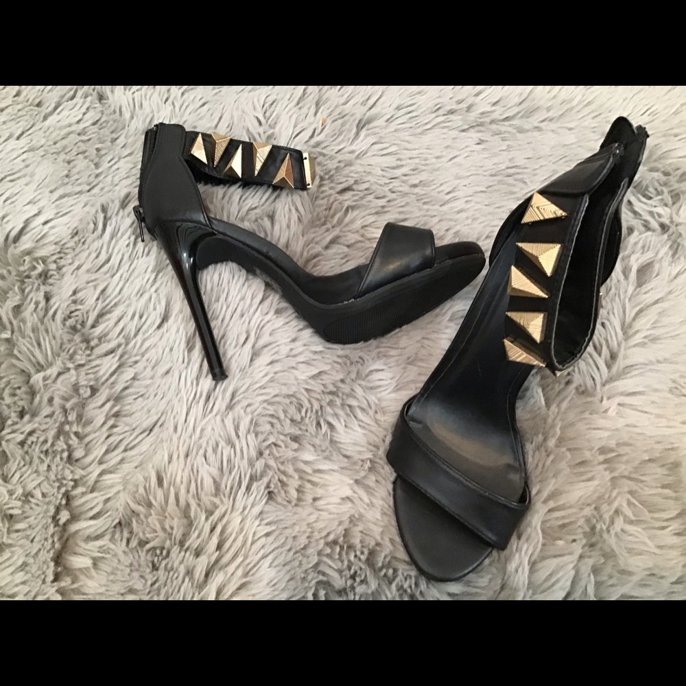 Black heels with ankle wrapped.